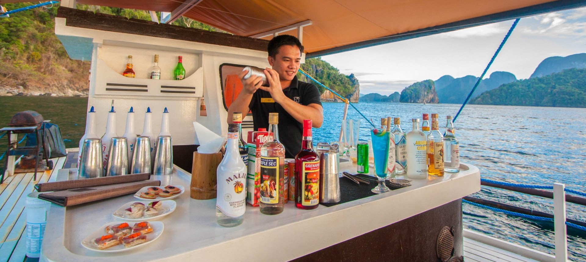 Farniente sur la terrasse d'un bungalow sur pilotis du Cauayan Island Resort